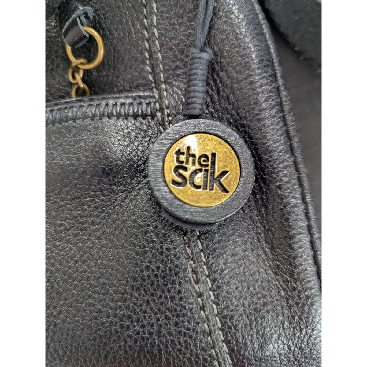 The Sak Black Leather Shoulder Handbag With Unique Patterned Lining