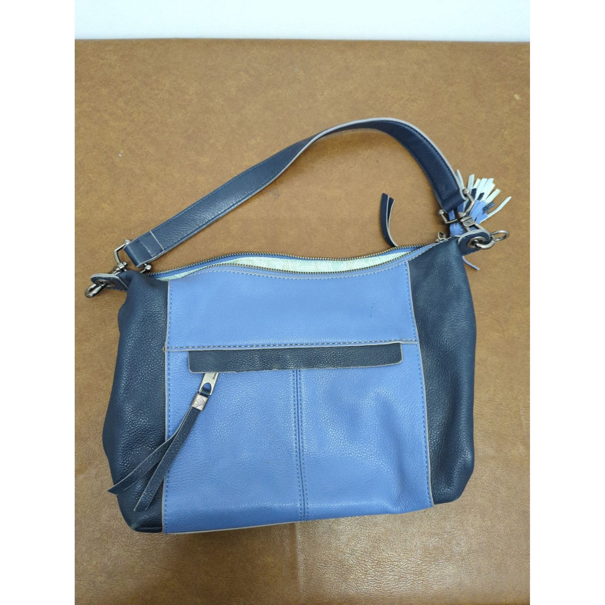 The Sak Leather Shoulder Bag In Blue & Navy With Tassel Accents And Zip Closure 14" X 10".