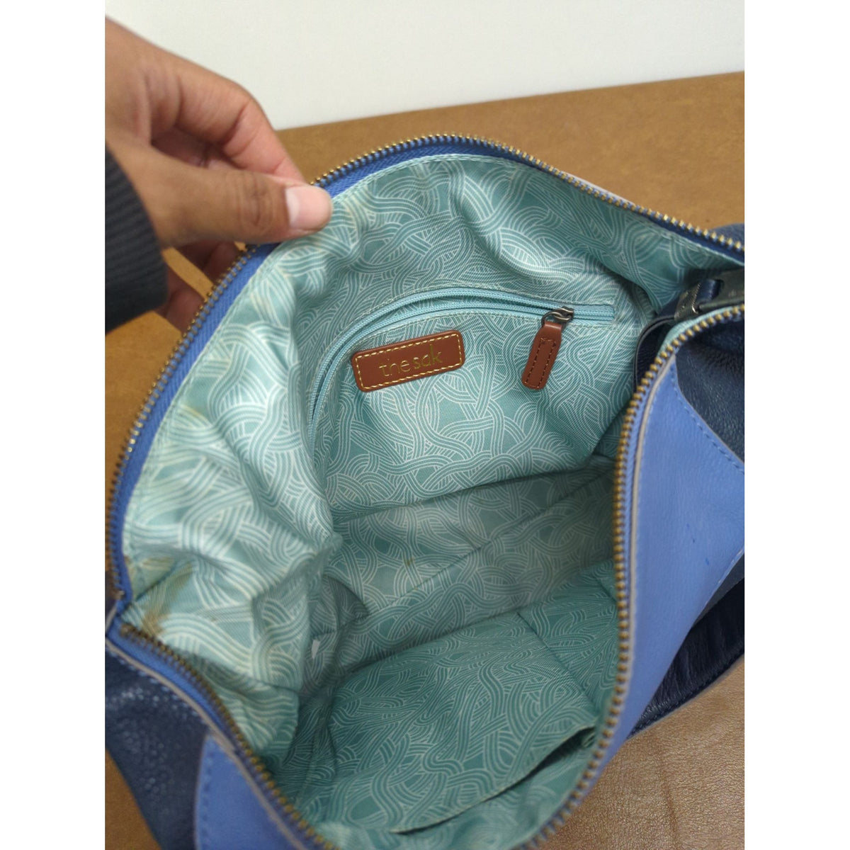 The Sak Leather Shoulder Bag In Blue & Navy With Tassel Accents And Zip Closure 14" X 10".