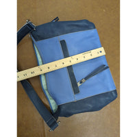The Sak Leather Shoulder Bag In Blue & Navy With Tassel Accents And Zip Closure 14" X 10".