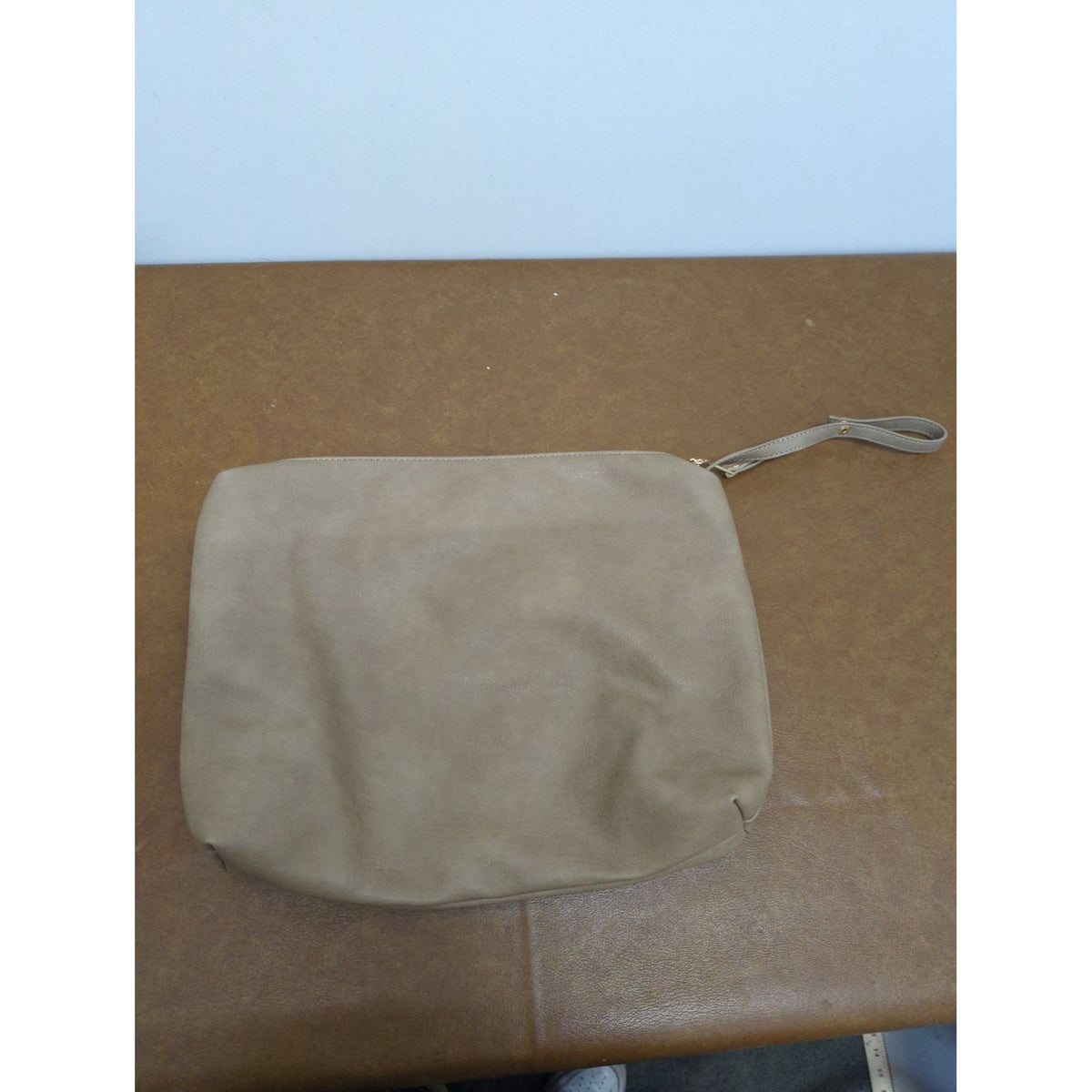 Madison West Beige Faux Leather Wristlet Clutch With Black & White Geometric Lining And Zip Closure