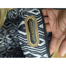 Madison West Beige Faux Leather Wristlet Clutch With Black & White Geometric Lining And Zip Closure
