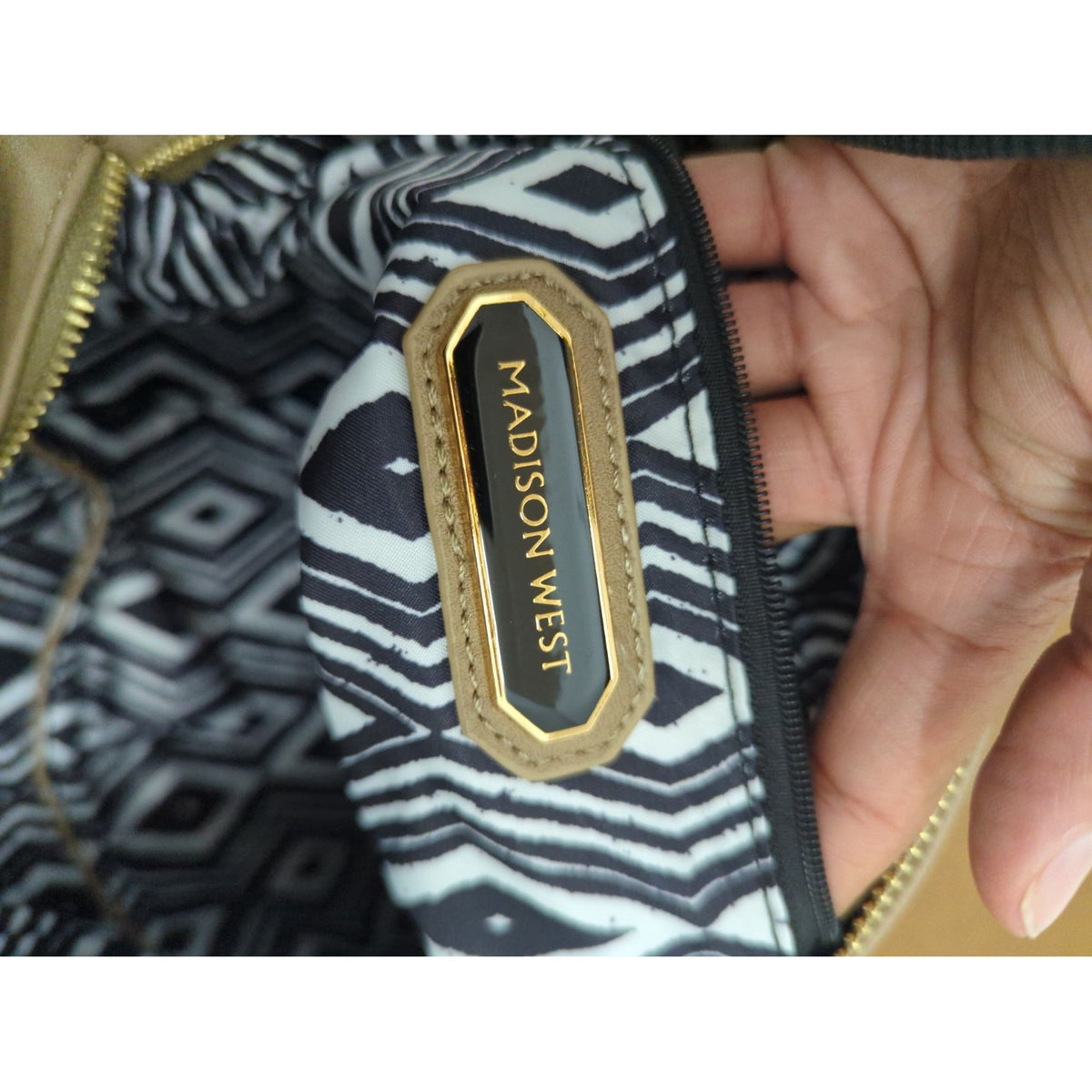 Madison West Beige Faux Leather Wristlet Clutch With Black & White Geometric Lining And Zip Closure