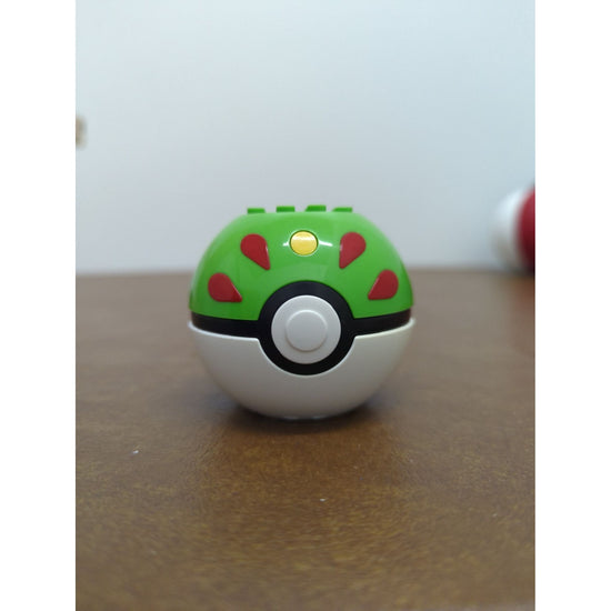 Pokémon-Themed Green & White Poké Ball Toy With Surprise Figurine Inside - Fun Collectible For Kids & Fans