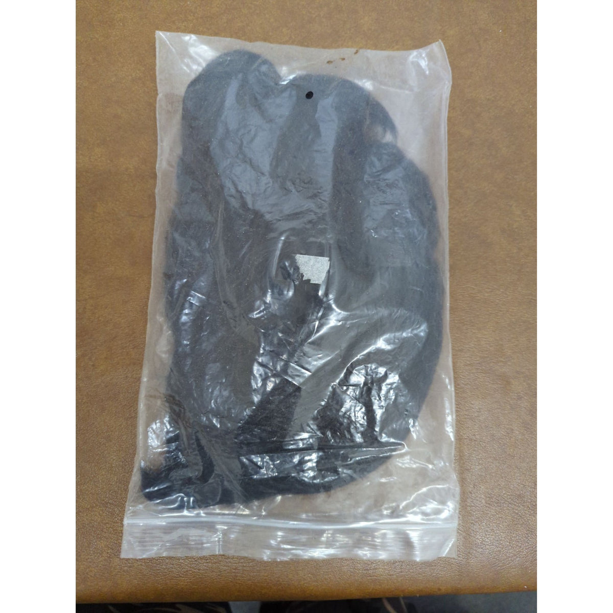 Black Synthetic Hair Extensions Packaged In Plastic Bag Unused