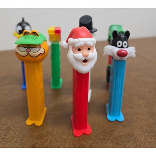 Vintage Pez Dispensers Lot Of 7 Featuring Garfield Santa Daffy Duck & More