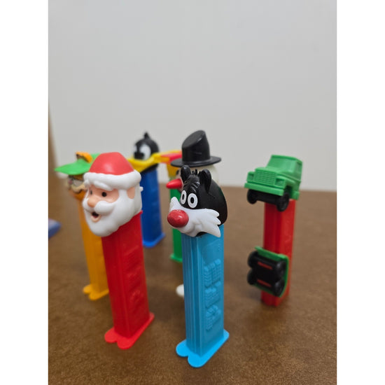Vintage Pez Dispensers Lot Of 7 Featuring Garfield Santa Daffy Duck & More