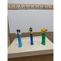 Vintage Pez Dispensers Lot Of 7 Featuring Garfield Santa Daffy Duck & More