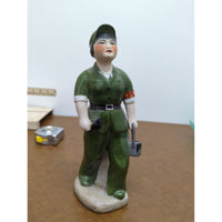 Vintage Ceramic Figurine Of Worker In Green Uniform Hand-Painted Standing On Base 9 Inches Tall