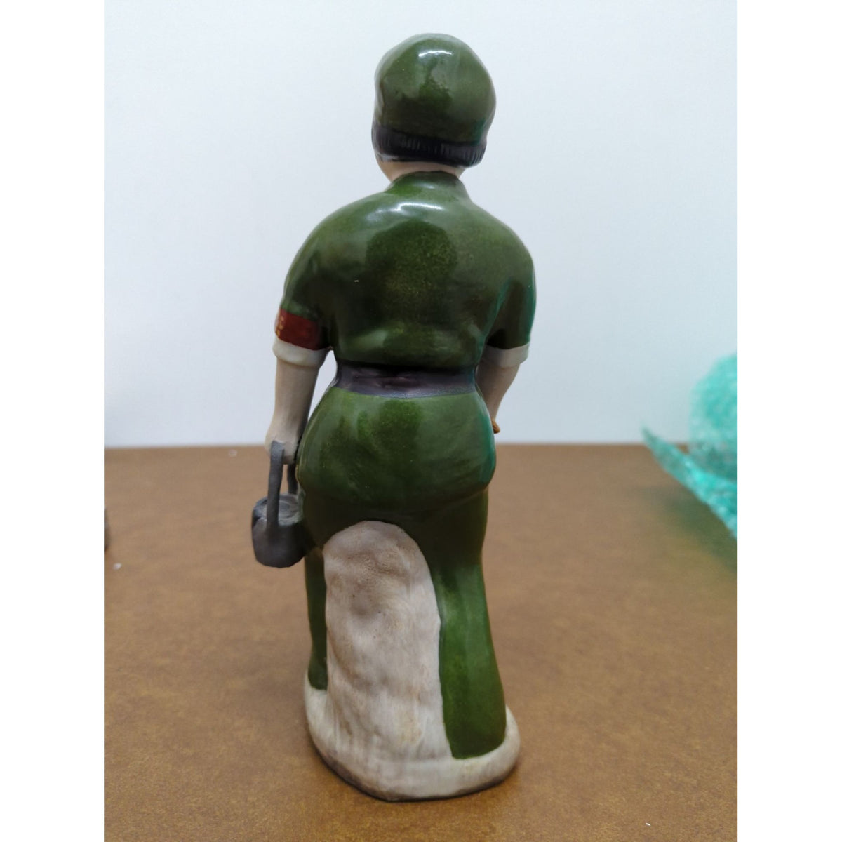 Vintage Ceramic Figurine Of Worker In Green Uniform Hand-Painted Standing On Base 9 Inches Tall