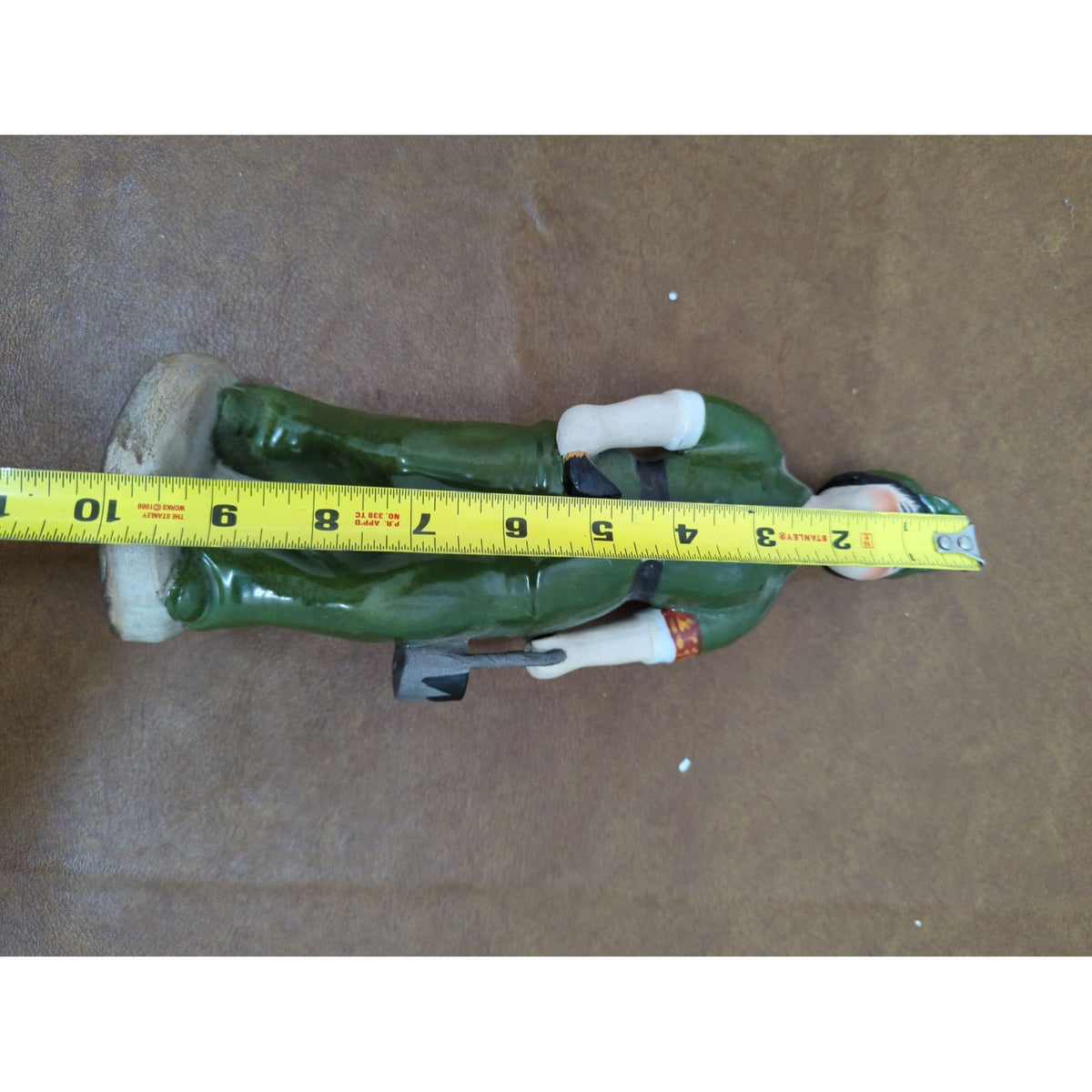 Vintage Ceramic Figurine Of Worker In Green Uniform Hand-Painted Standing On Base 9 Inches Tall