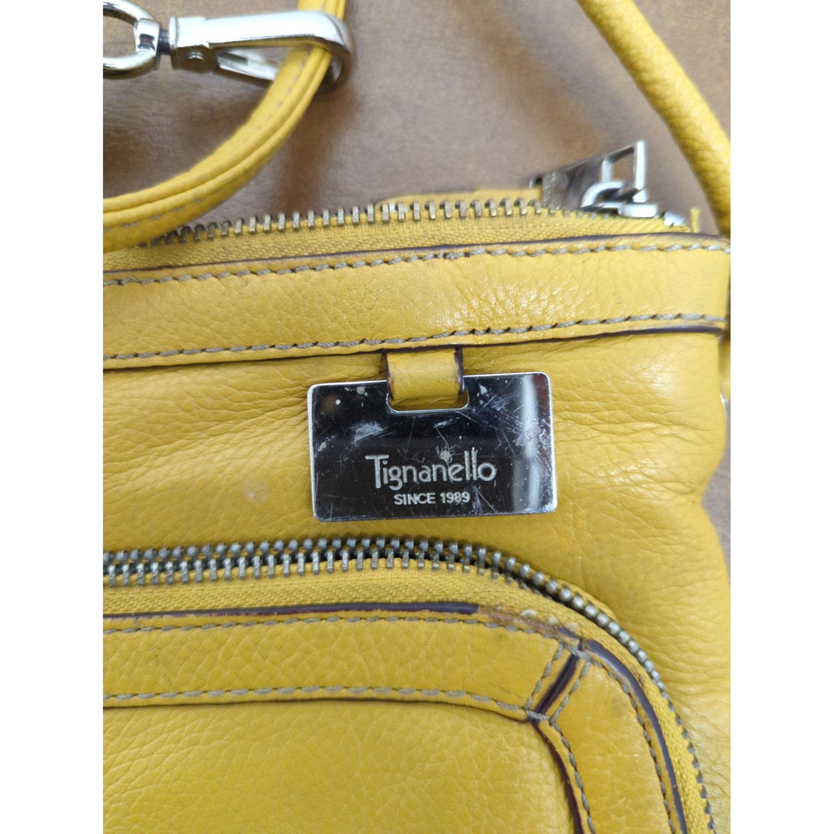 Tignanello Yellow Leather Crossbody Bag With Multiple Zipper Pockets & Chain Print Lining