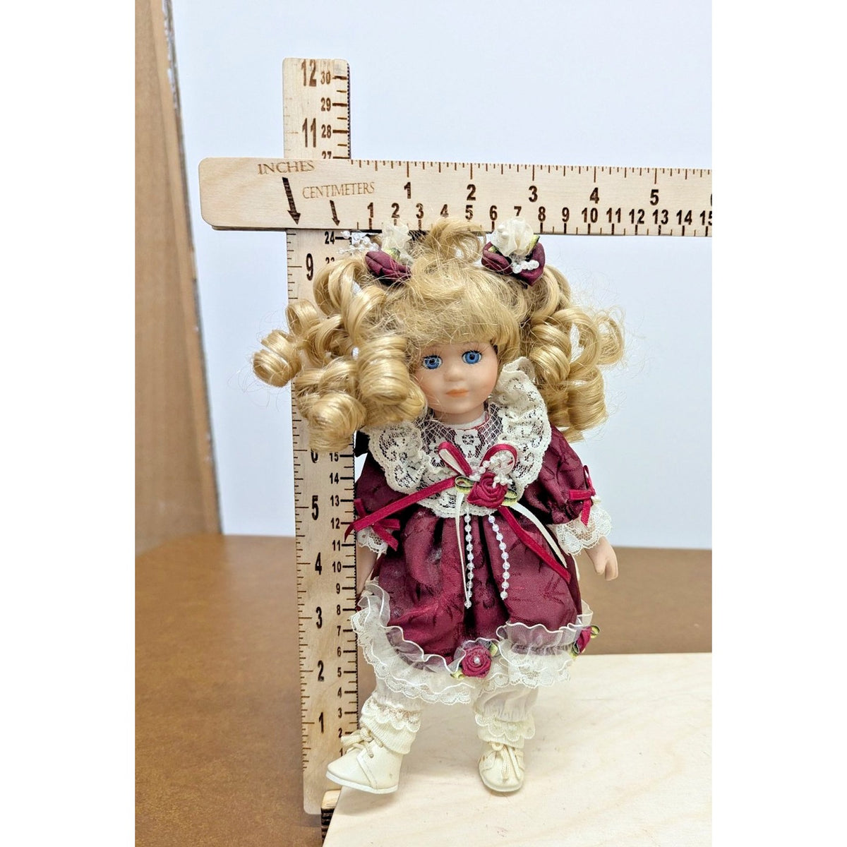 Porcelain Blonde Doll In Burgundy Lace Dress With Accessories