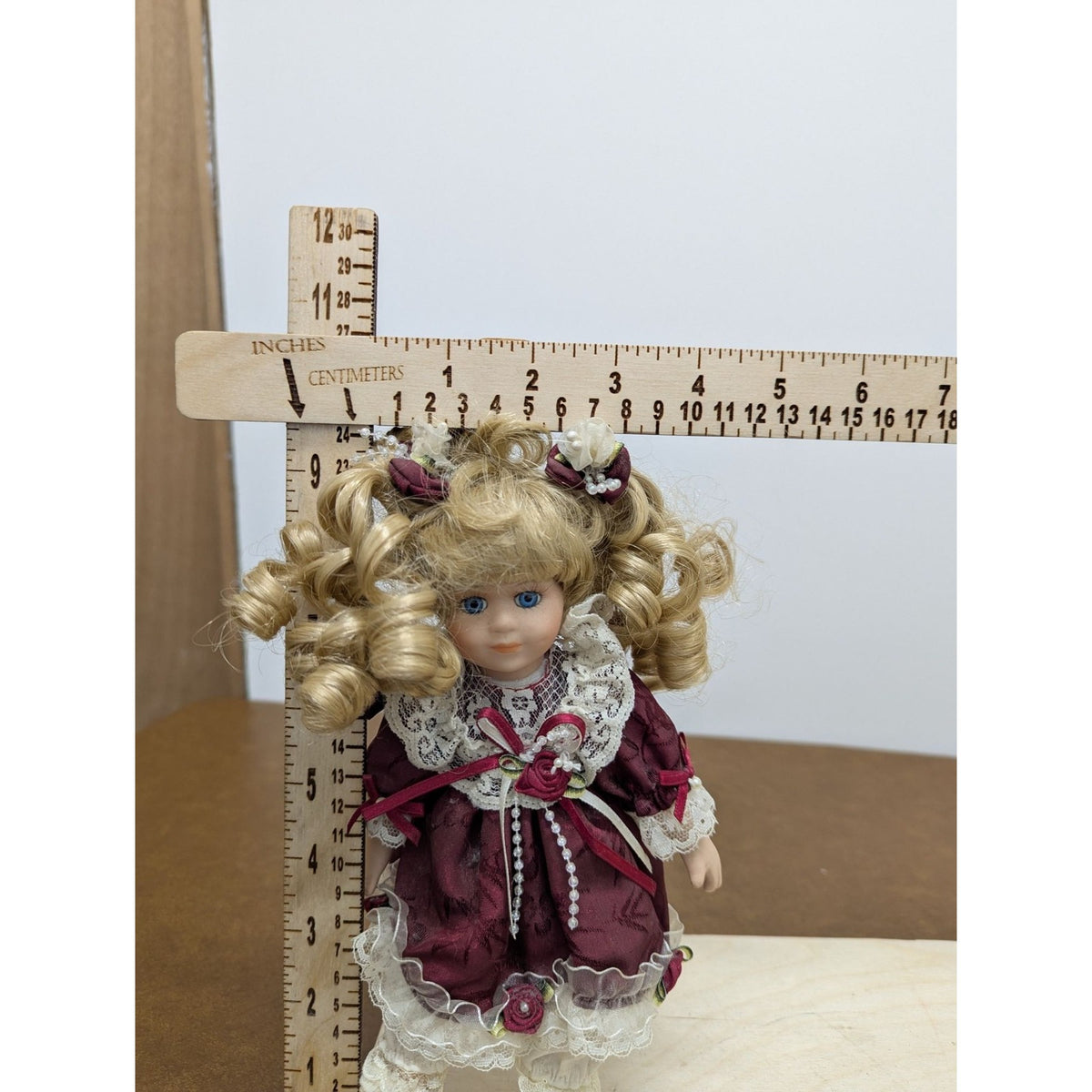 Porcelain Blonde Doll In Burgundy Lace Dress With Accessories
