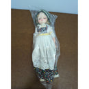 Vintage Porcelain Doll In Traditional Dress 12" With Eyelet Apron & Floral Skirt